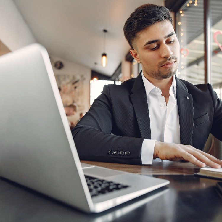 New business owner reviewing operations on a laptop during the first 90 days of ownership